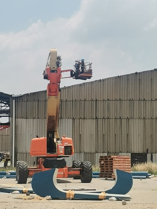 Articulating boom lift on site ready for elevated access work