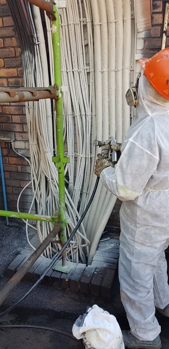 Spray application of fire-rated coating to bundled cabling