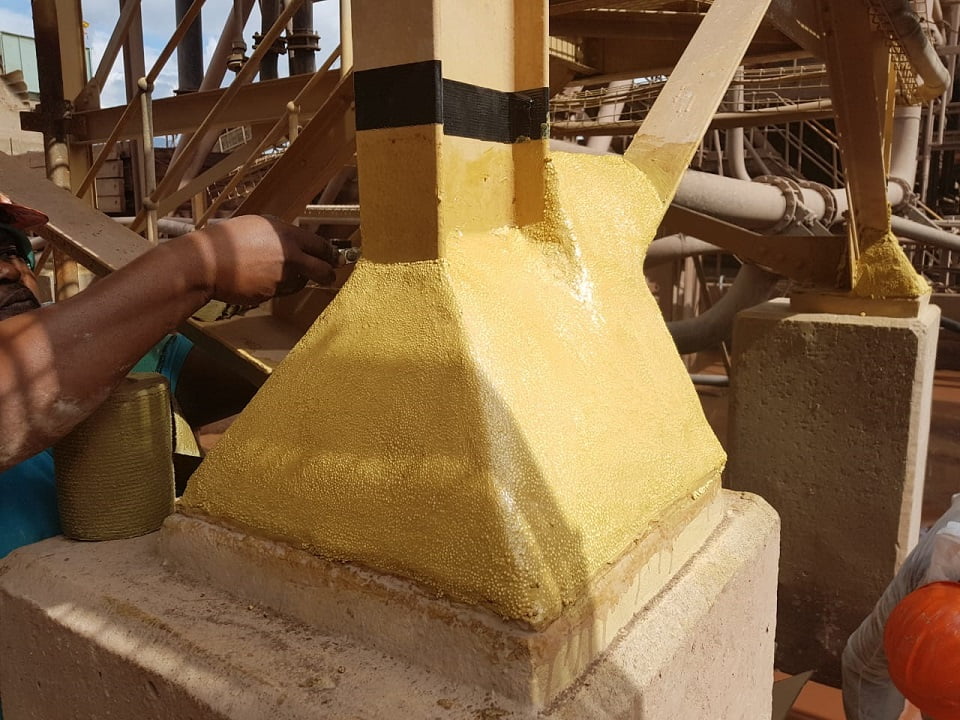 Denso paste application to column baseplate before final wrap