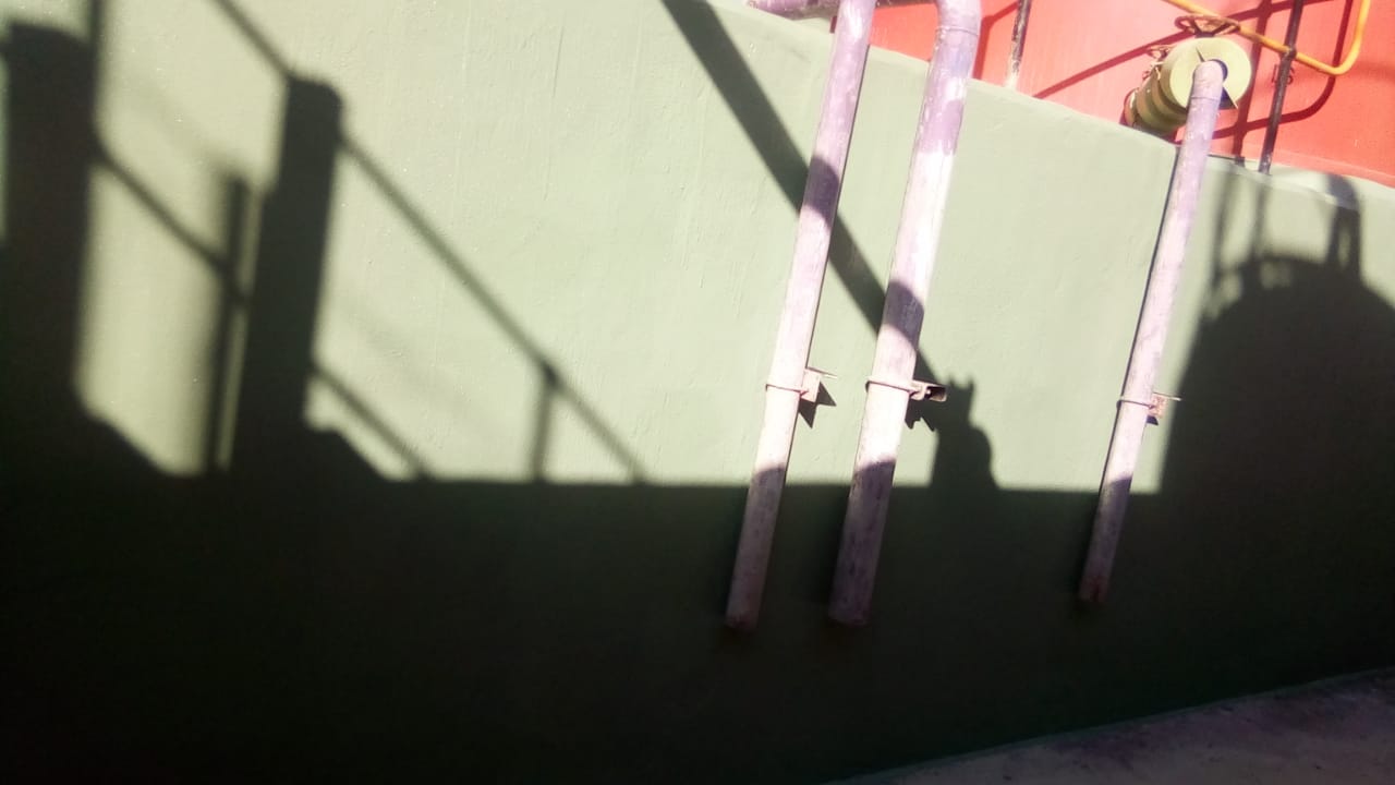 Acid-resistant coating around bund pipe penetrations