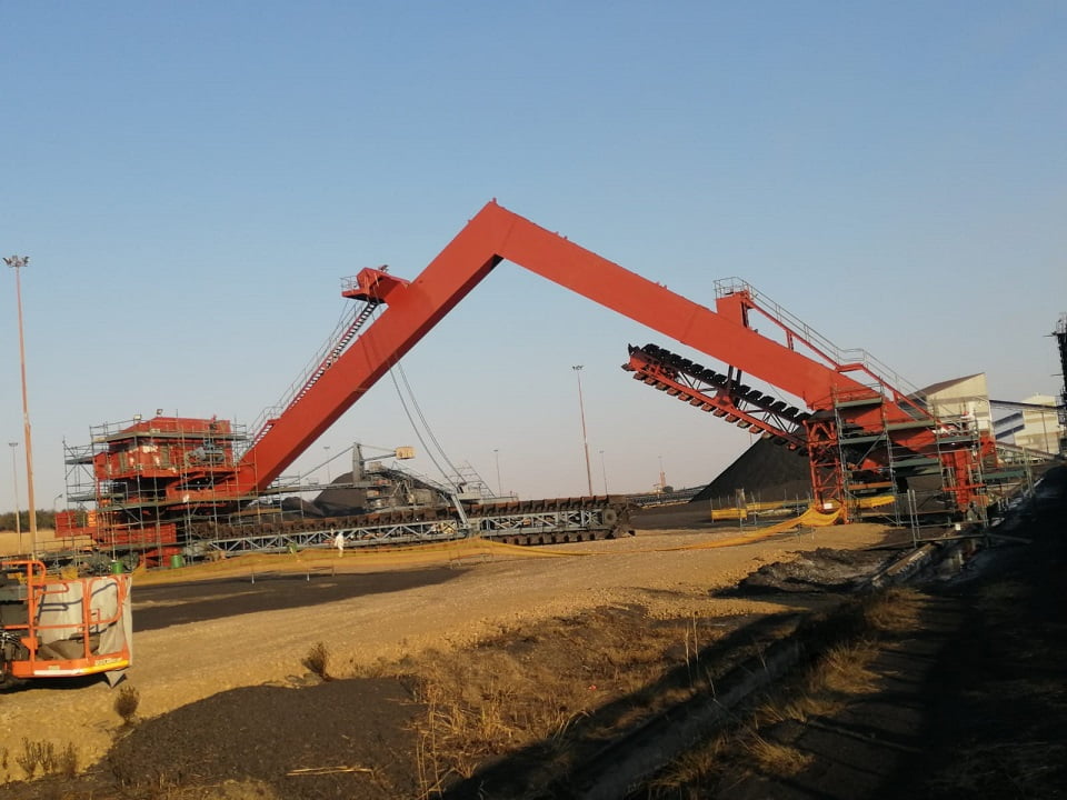 Stacker-reclaimer boom in fresh signal-red protective coating system