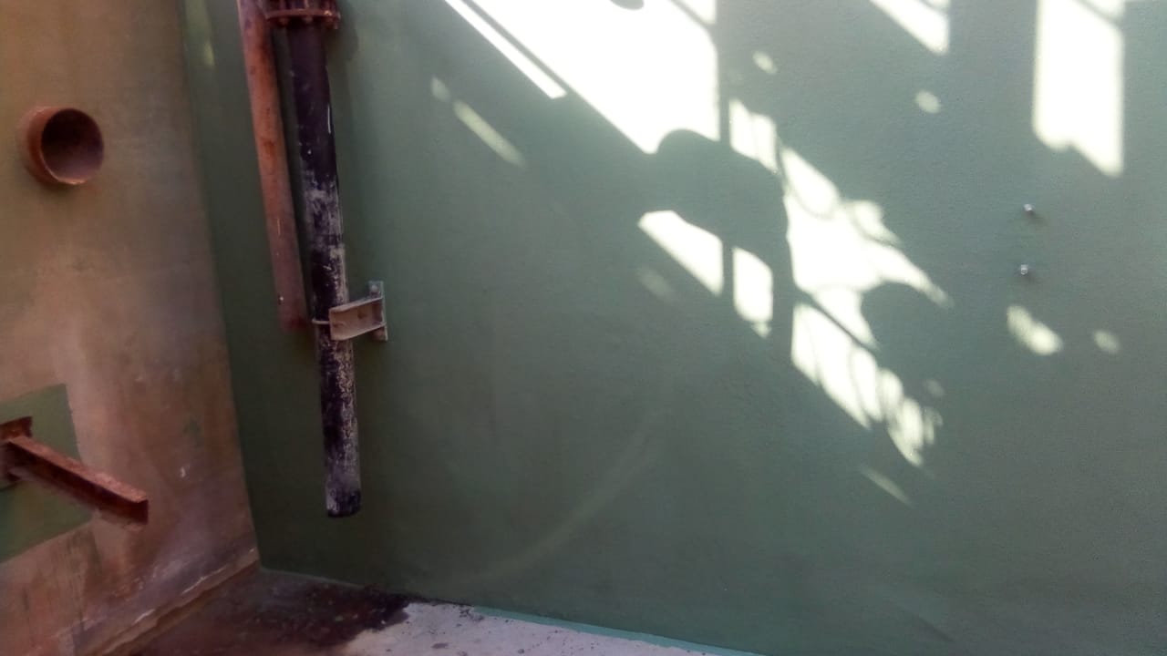 Lined containment wall with pipework detail