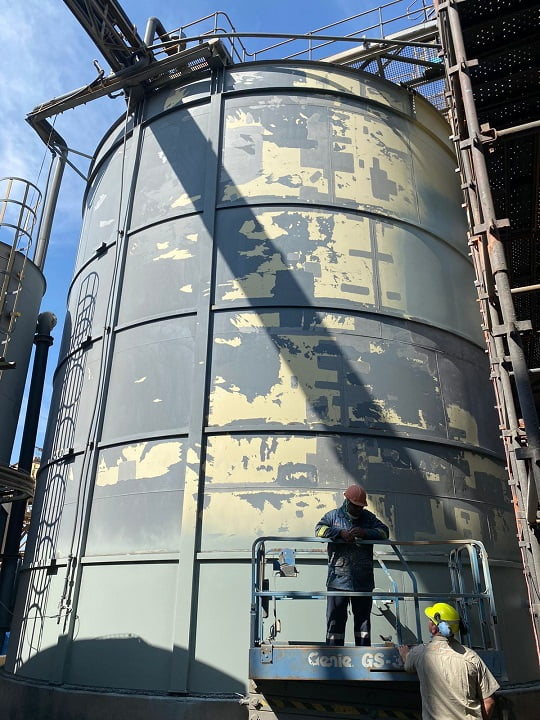 Storage tank surface preparation in progress prior to recoating