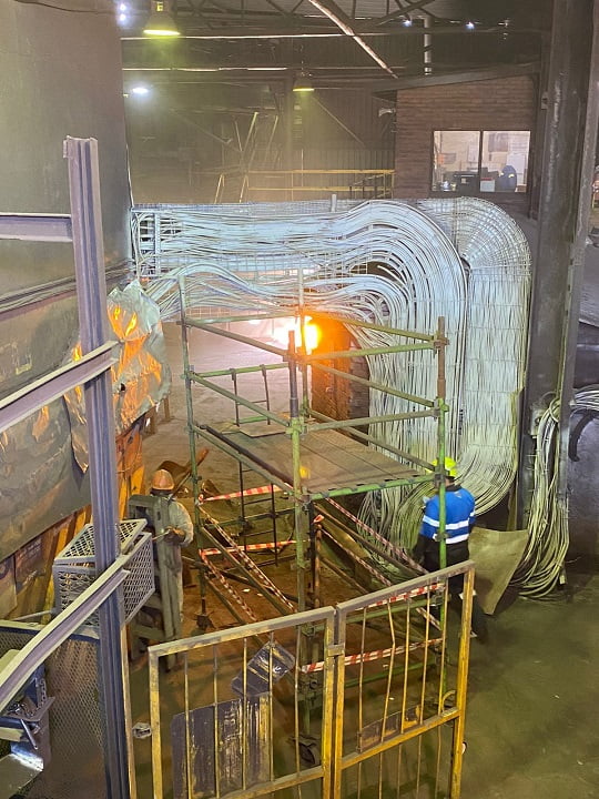 Fireproofing application on overhead cable trays inside an industrial plant