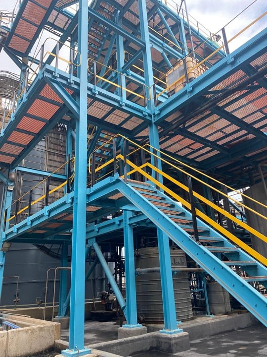 Process platform and staircase recoated in blue and yellow safety scheme