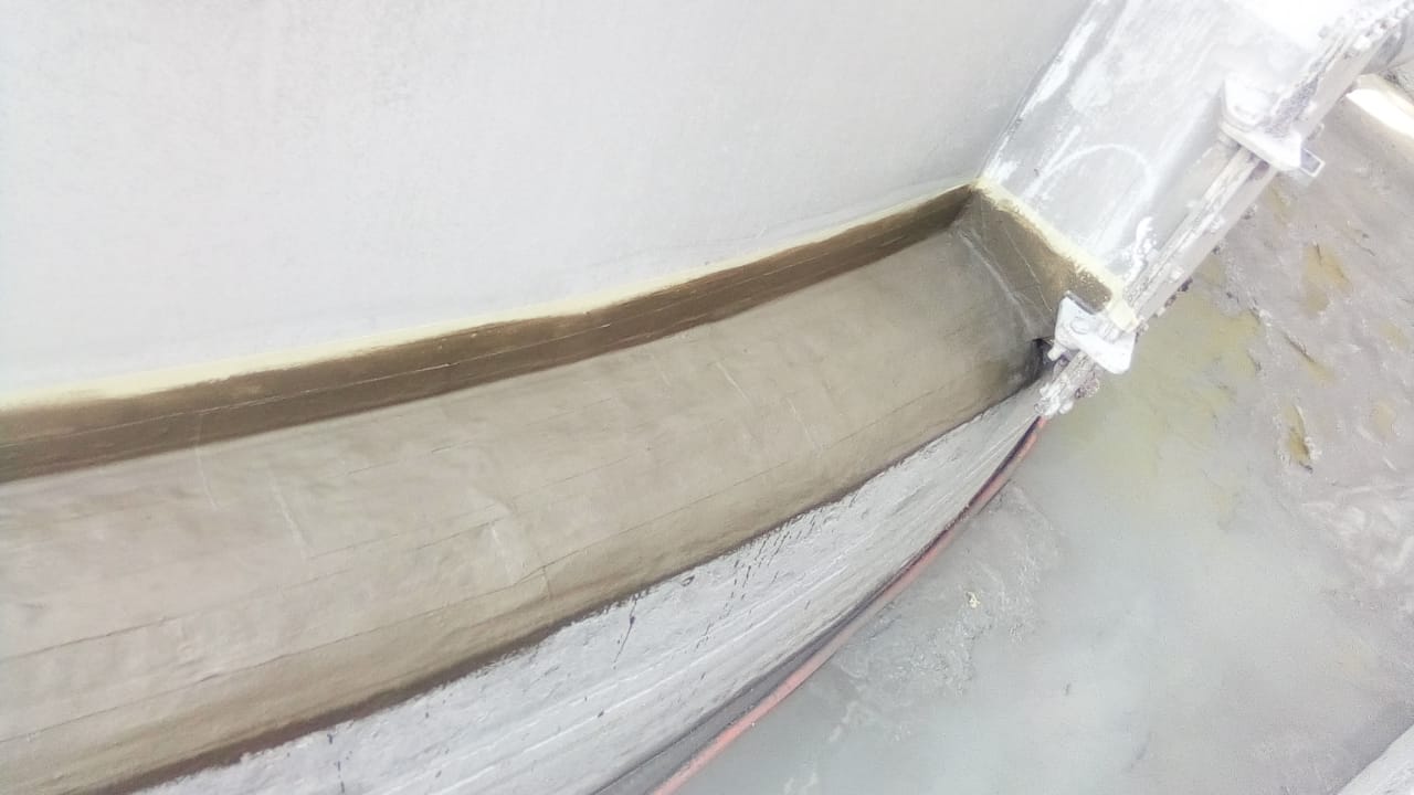 Detail of tank-to-floor coating transition