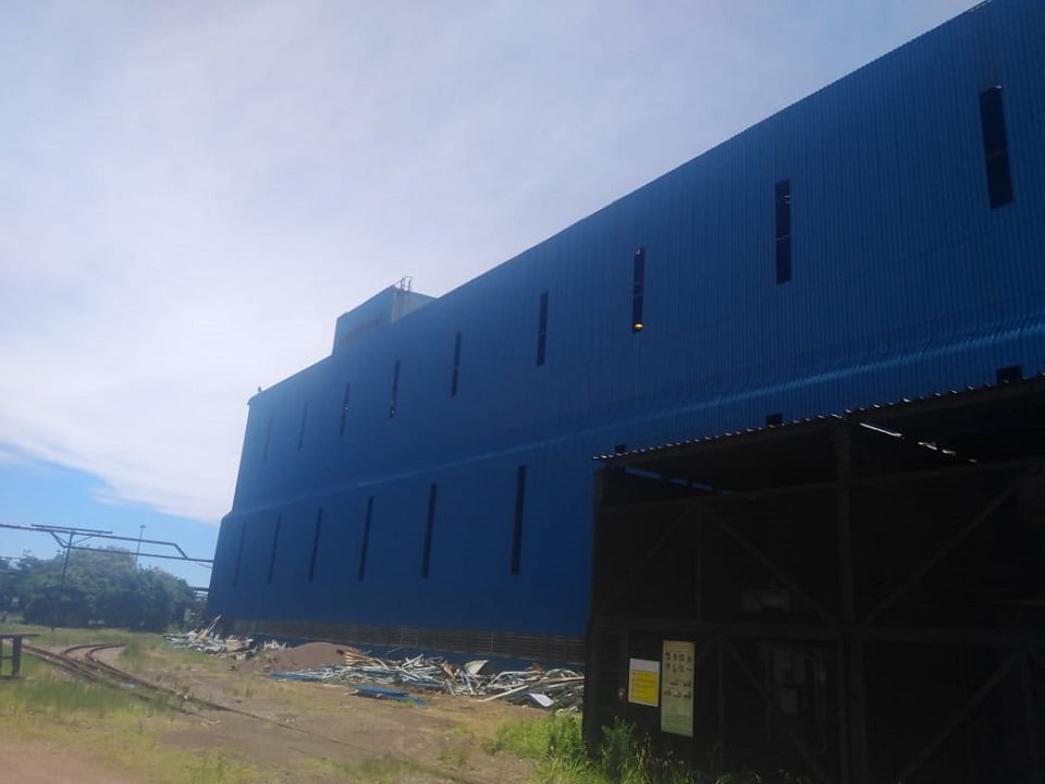 Newly clad industrial building with full blue side sheeting installation