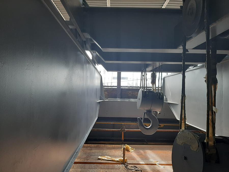 Overhead crane beams and structural steel recoated in dark grey