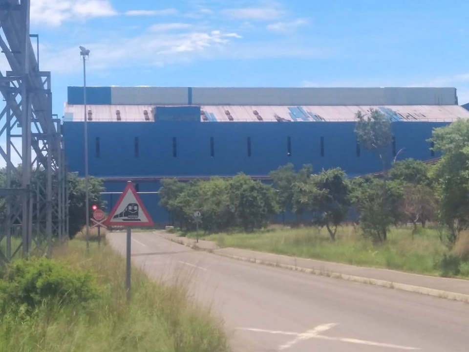 Industrial building with side sheeting complete and roof works in progress
