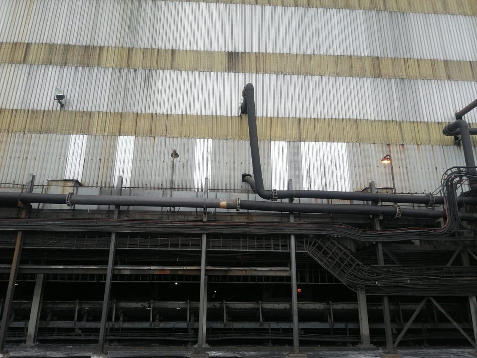 Industrial façade with asbestos cladding awaiting abatement