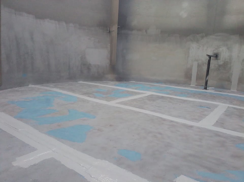 Tank floor lining application in progress
