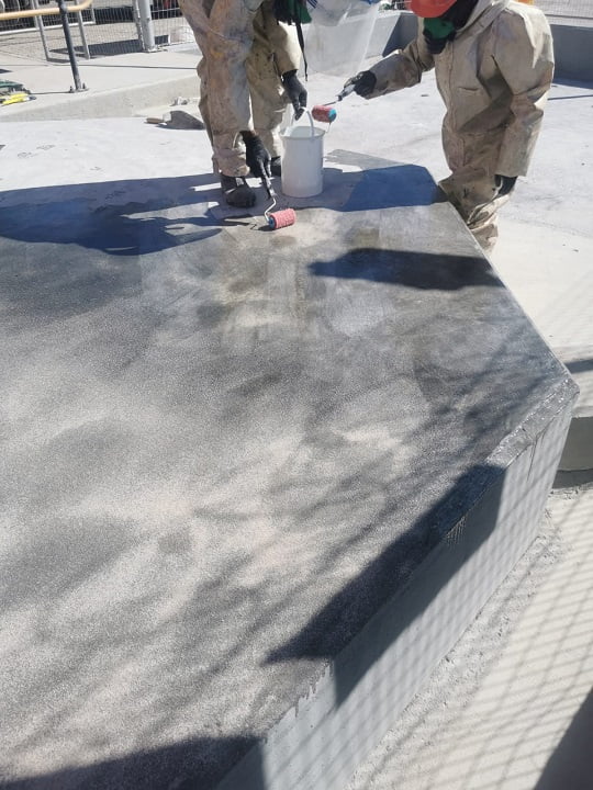 Application of intermediate coat with engineering fabric