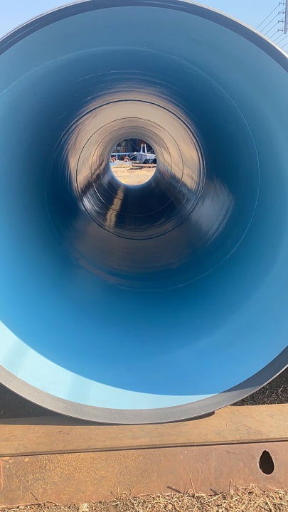 Internal view of long pipe spools with smooth blue protective lining