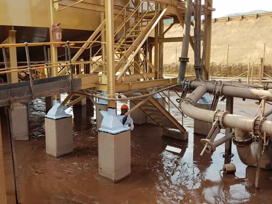 Coated structural baseplates protecting columns in flooded plant area